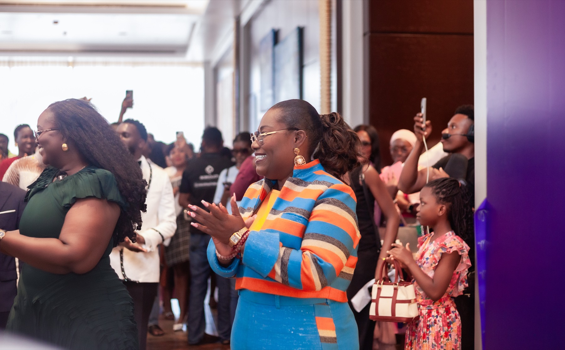 Nana Oye applauding at a public engagement